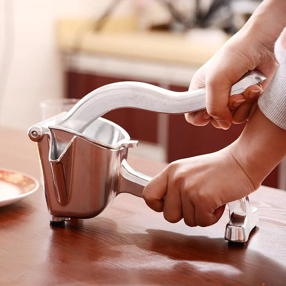 Silver heavy duty aluminium alloy lemon squeezer with extra large bowl on kitchen counter