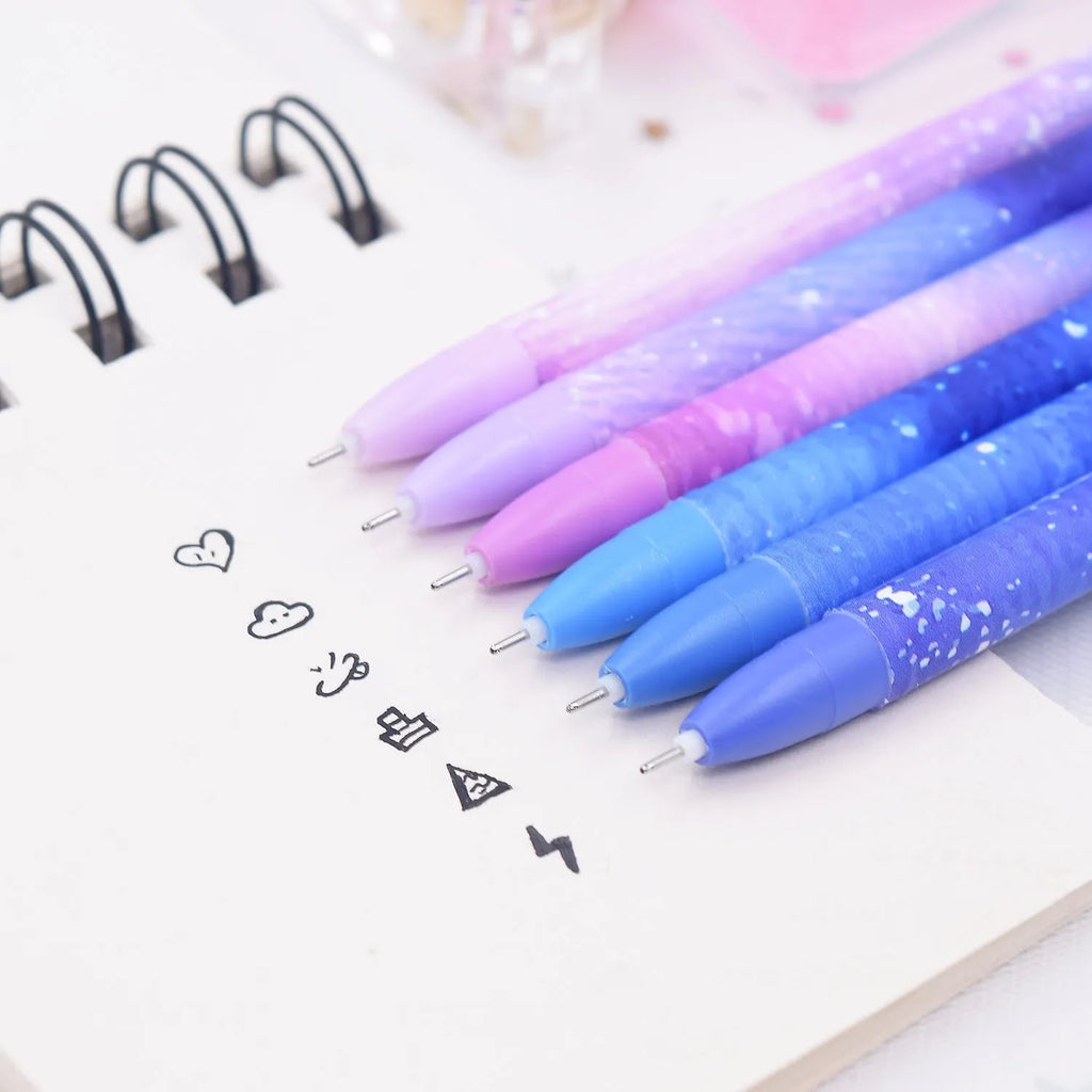 Box containing 12 assorted quick-drying gel pens with 0.5mm fine tips on a white background.