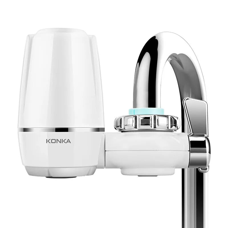 White plastic faucet water filter with ceramic cartridge and set of thread adapters