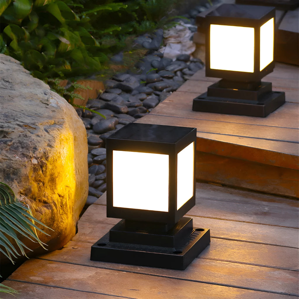 Set of solar-powered LED garden lights in various styles illuminating an outdoor patio at dusk.