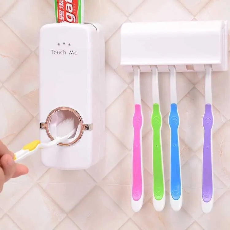 White adhesive plastic toothbrush holder set mounted on a smooth bathroom wall