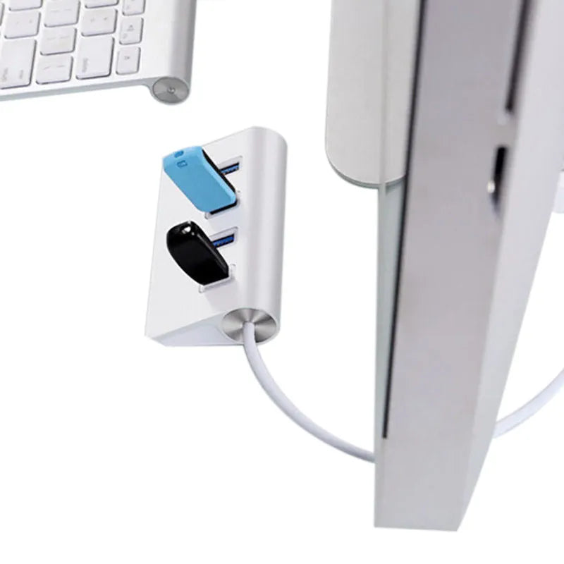 Silver USB-C to 4-Port USB 2.0 hub with aluminium alloy body on white background