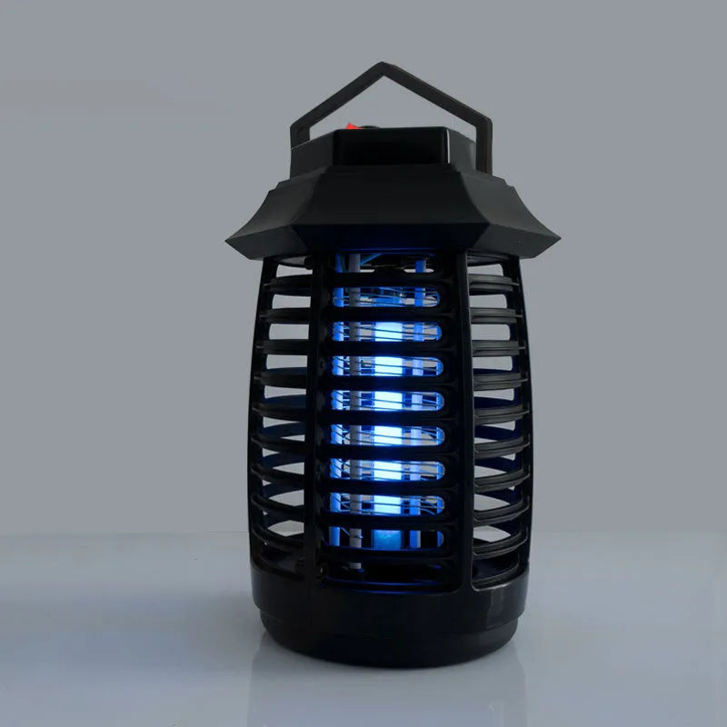 Black aromatherapy mosquito lamp with a protective metal grid, shown with optional UV or LED light tubes.