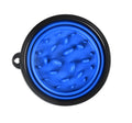 Foldable pet slow food bowl in blue with collar buckle on outdoor grass