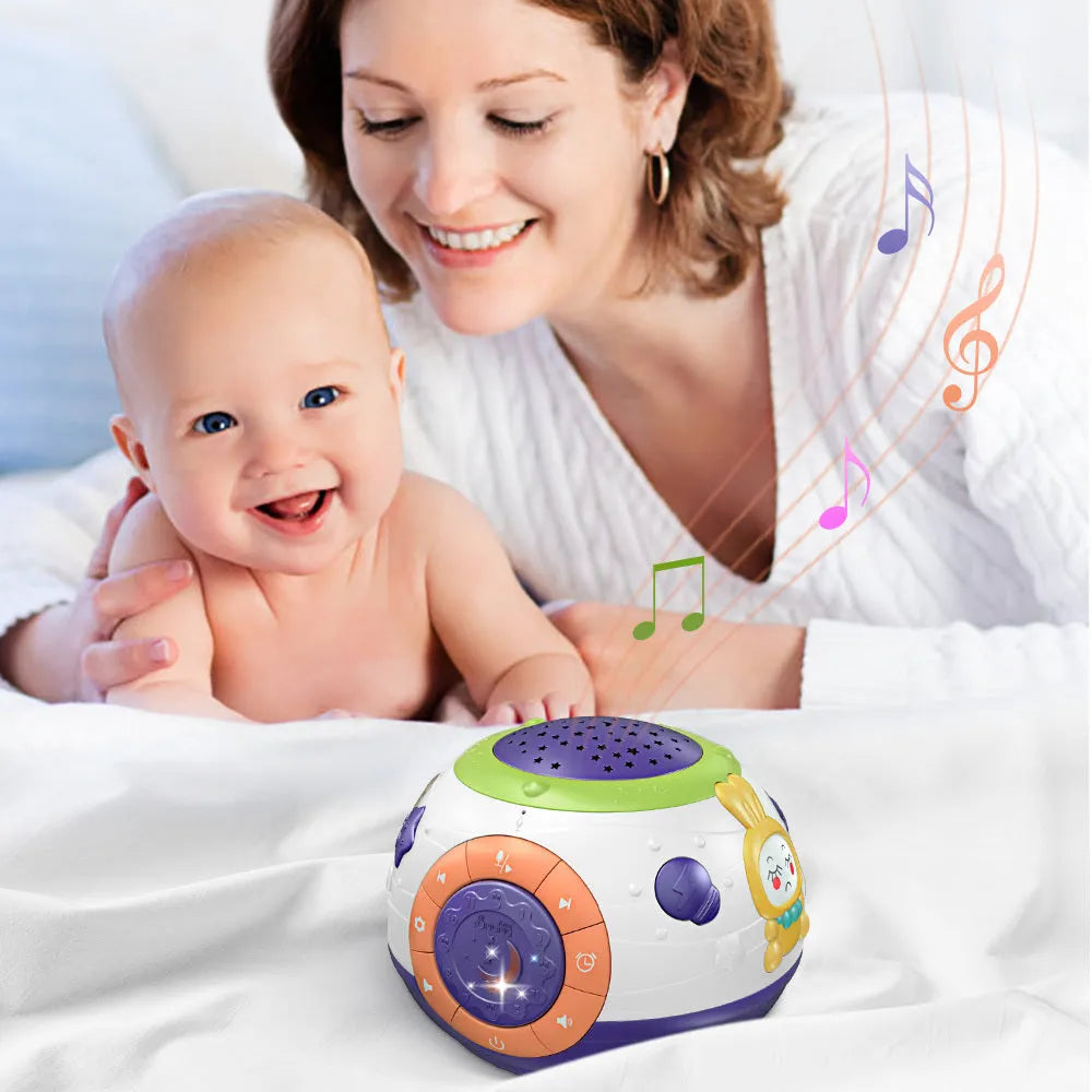 White plastic starry sky night light projector for children on a table, projecting blue stars onto a wall.