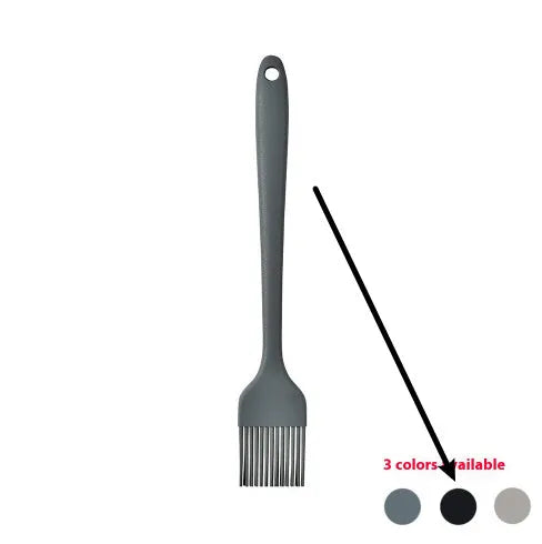 Black silicone kitchen utensil set with 12 tools in a rotating storage bucket on a kitchen countertop