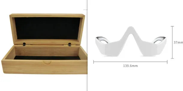 Pink and white 3D micro-current eye massager with glasses-style design on a grey background.