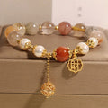 Women's Japanese-style crystal bracelet with pearls and Chinese 'Cai' character charm.