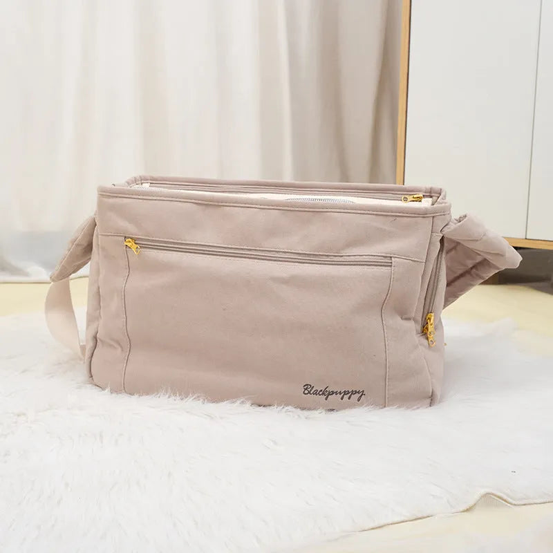 Soft surface large capacity pet messenger bag in black and beige with shoulder strap