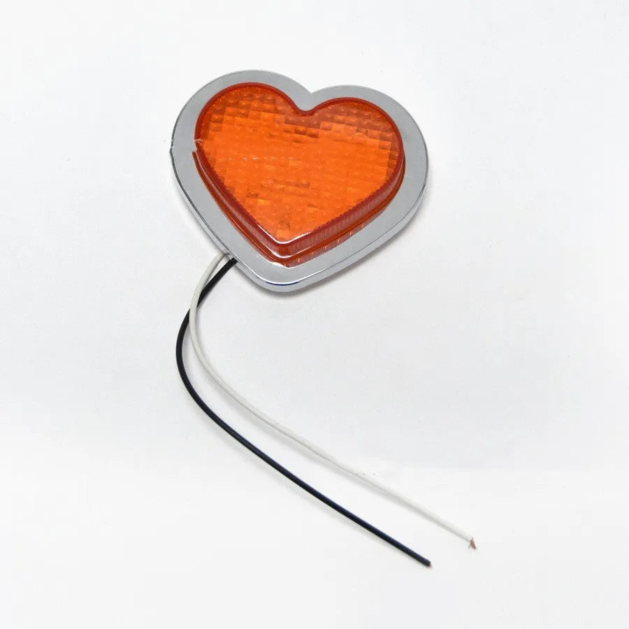 Heart-shaped red LED automotive sidelight mounted on car fender