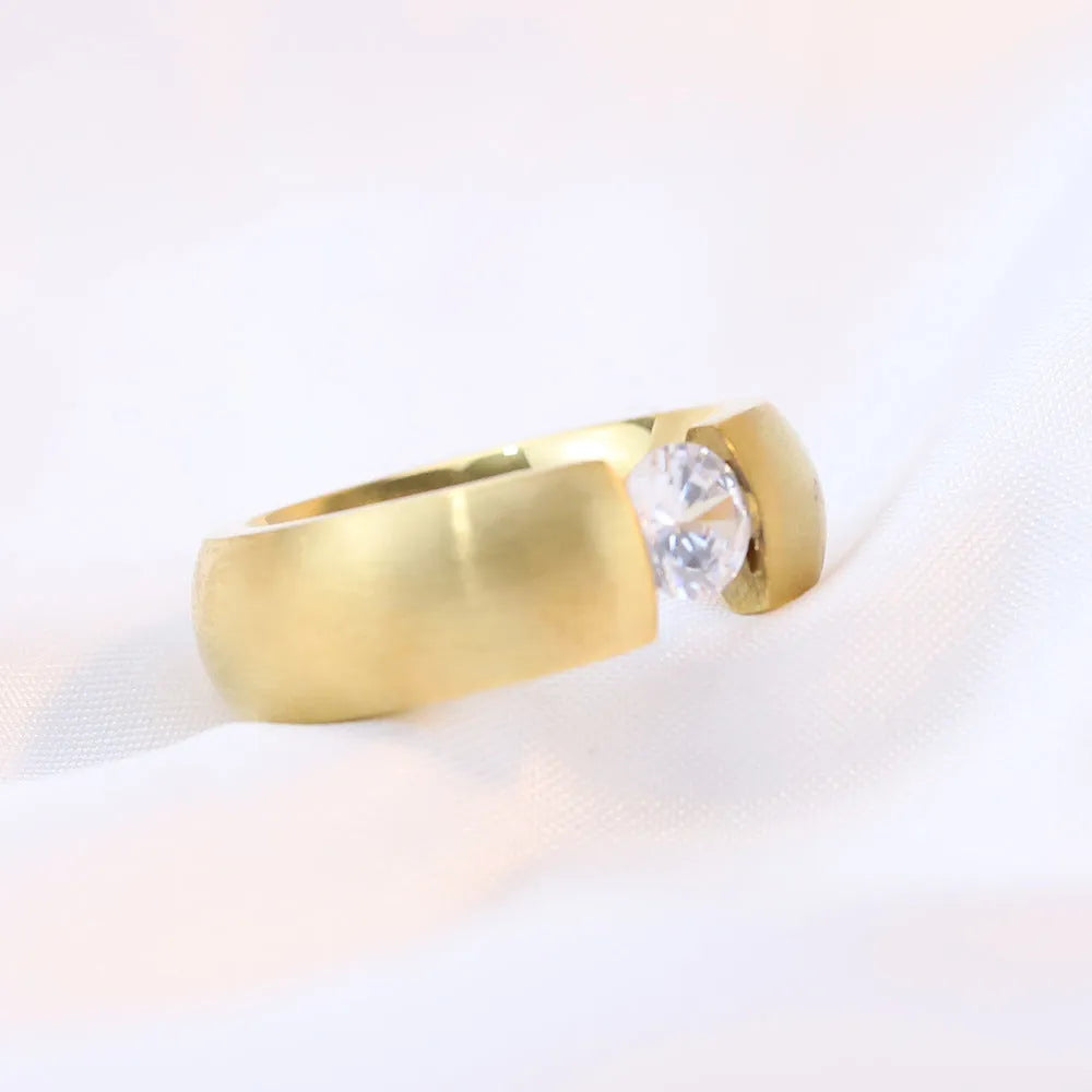 Minimalist gold diamond ring on plain background, titanium steel, geometric shape US sizes 6-10