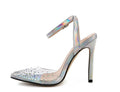 Clear PVC women's sandals with a pointed toe and a thin 10cm stiletto heel on a plain background.