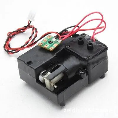Black electronic smoke box accessory for 1/16 scale RC tank models on a grey surface.