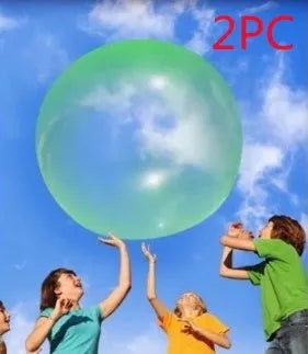 Assortment of inflated pink, yellow, blue and green TPR bouncy balls in different sizes on a plain background.