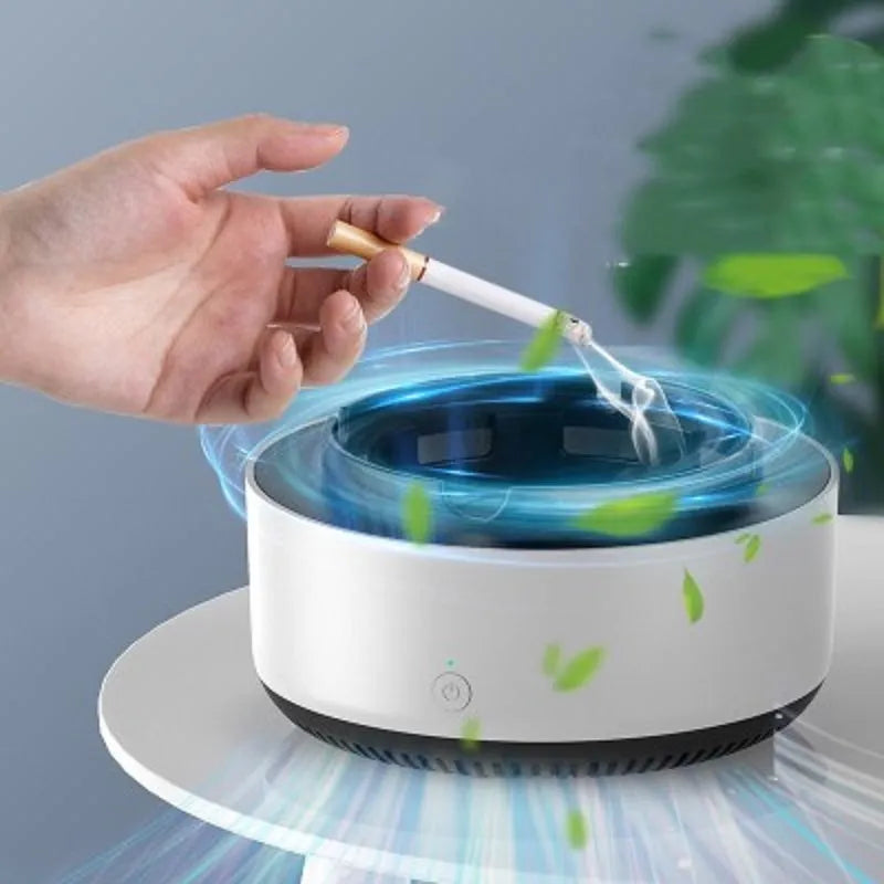 Grey electronic air purifier ashtray with cigarette butt grooves on a table