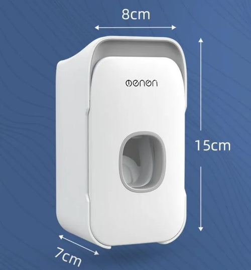 Automatic toothpaste dispenser in blue colour mounted on a bathroom wall