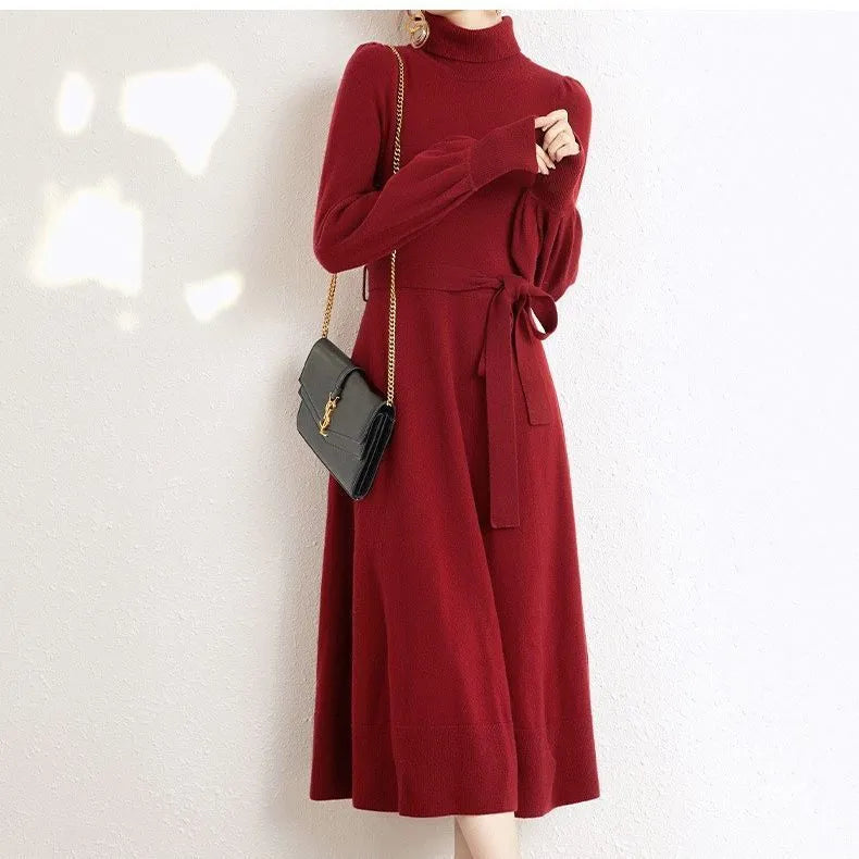 Rose red turtleneck knit dress with long sleeves, elastic waist, and a loose, flowing mid-length skirt.
