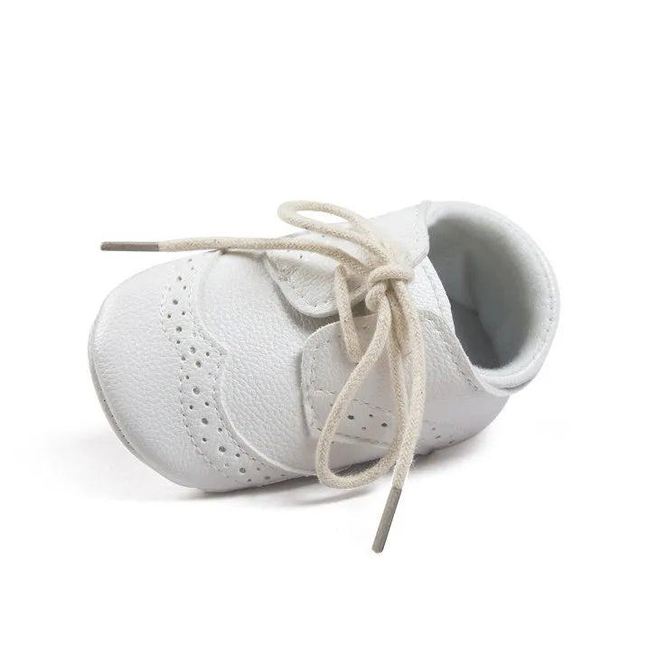 Vintage style soft-soled baby walking shoes in black, grey, light brown and white for infants 0-12 months