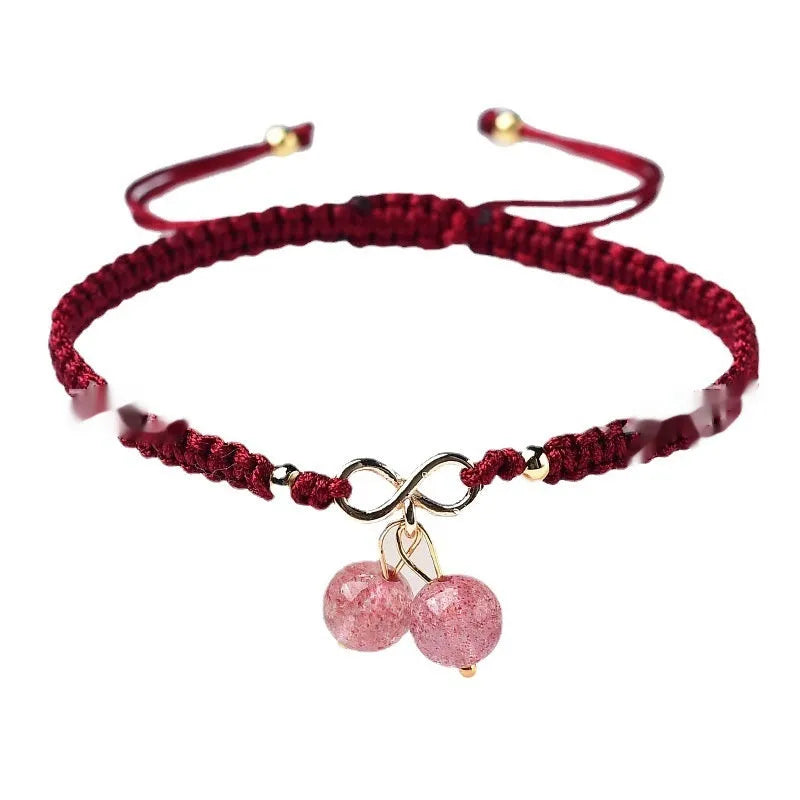 Women's Natural Strawberry Quartz bracelet with a fruit-shaped crystal bead on an elastic cord.
