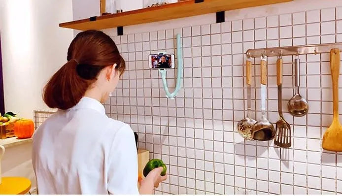 Black flexible rubber phone holder with suction cup bent into shape showing 62cm length
