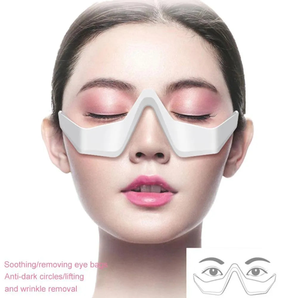 Pink and white 3D micro-current eye massager with glasses-style design on a grey background.