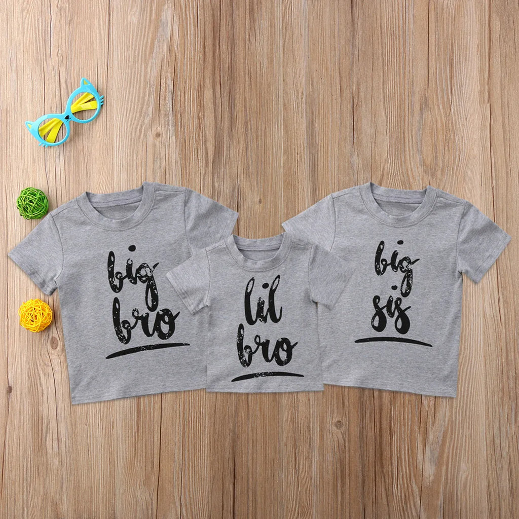 Grey cotton t-shirt for a child with a print, shown in sibling-themed colour variations.