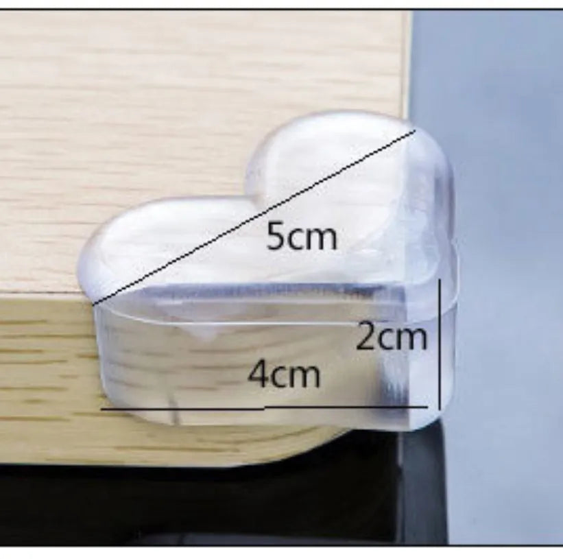 Heart-shaped PVC anti-collision baby safety corner protector on furniture edge, 5cm x 4cm x 2cm