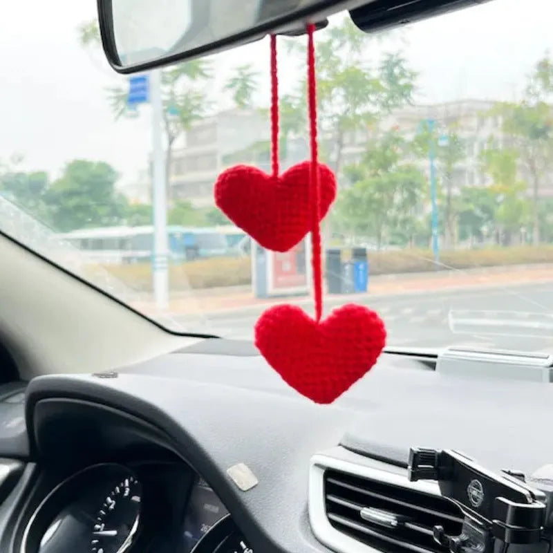 Green and white knitted wool car plant decoration with basin base and hanging rope