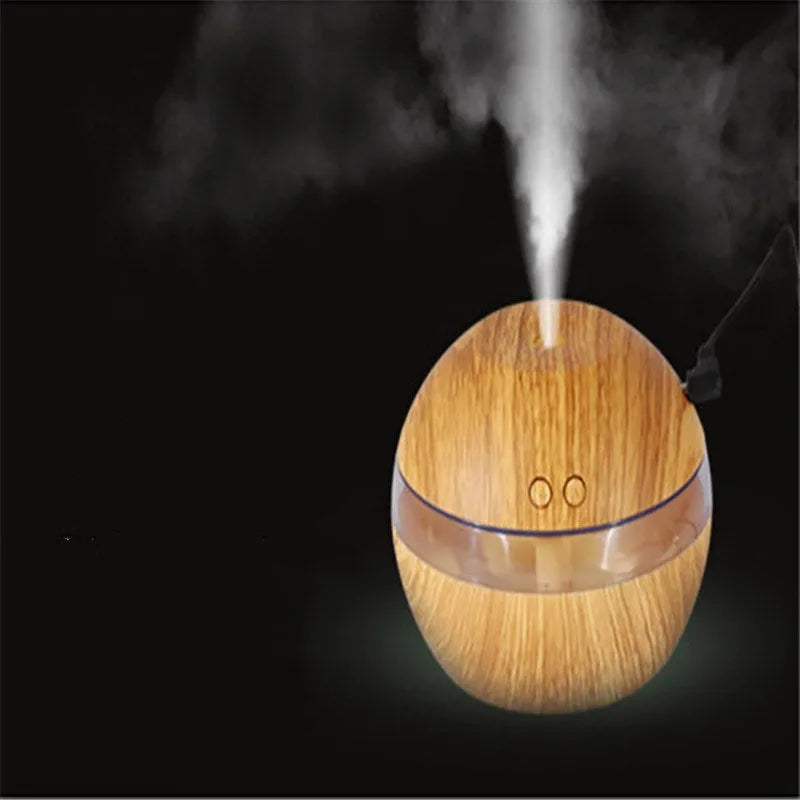 Compact brown wood grain USB humidifier with 200ml water tank on a desk.
