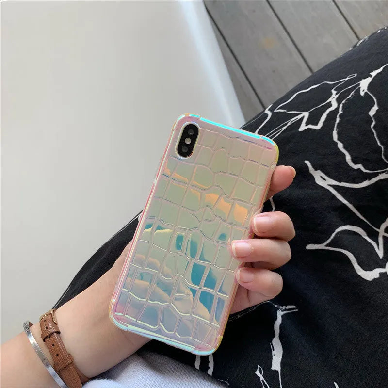 Silver glossy silicone laser phone case with textured surface for iPhone, showing lanyard hole and precise camera cutout.