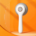 Blue and white self-cleaning pet grooming brush with a slicker comb head for cats and dogs.