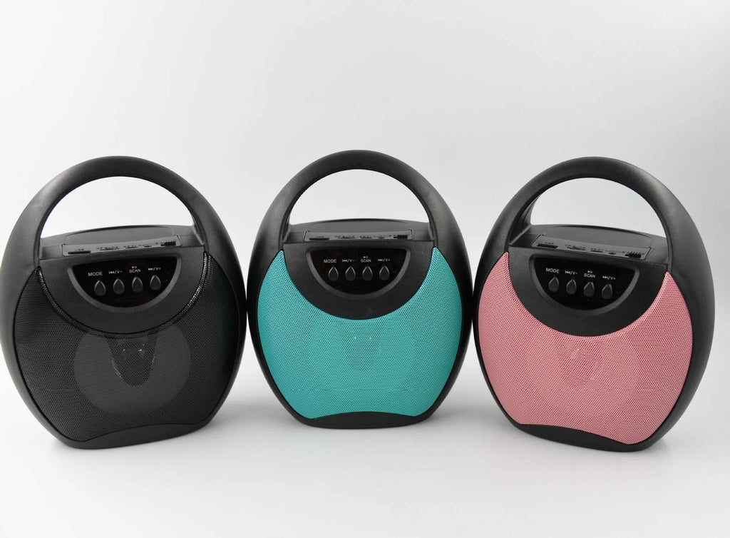 A portable Bluetooth speaker in black, blue, or pink plastic casing with USB and SD card slots.