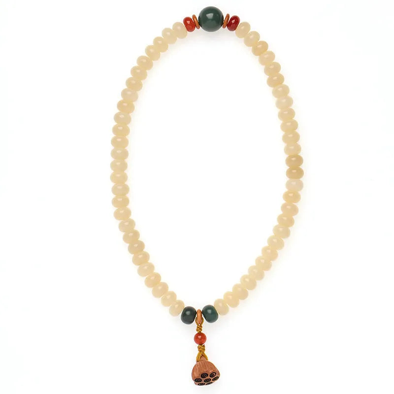 Cream topaz bodhi root wooden bracelet with flat round beads on wrist