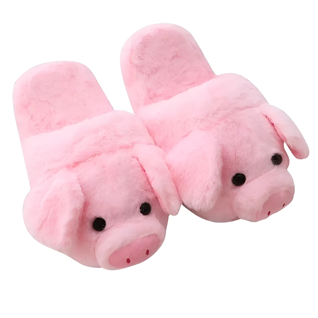 Pink pig-shaped plush house slippers with a short pile exterior, shown on a plain background.