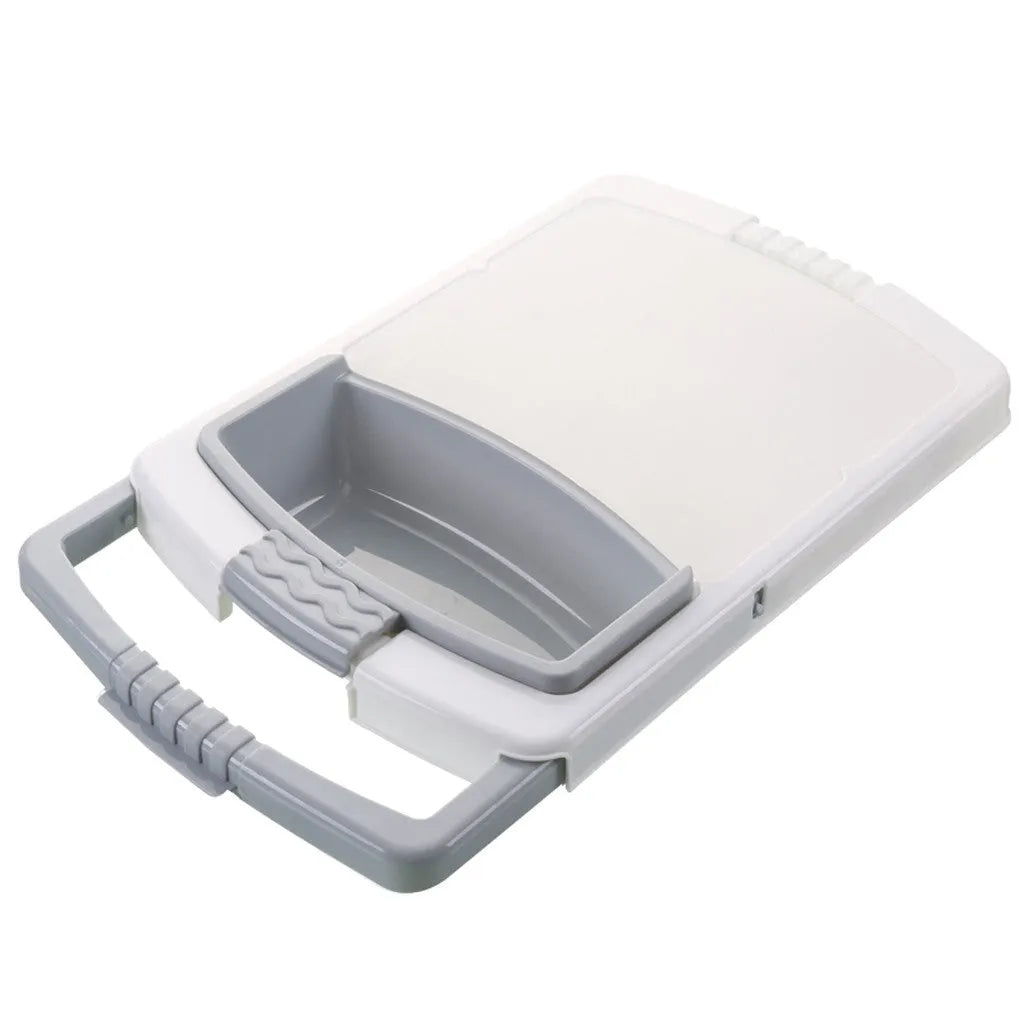 Green multi-function cutting board with drainage holes mounted on a kitchen sink