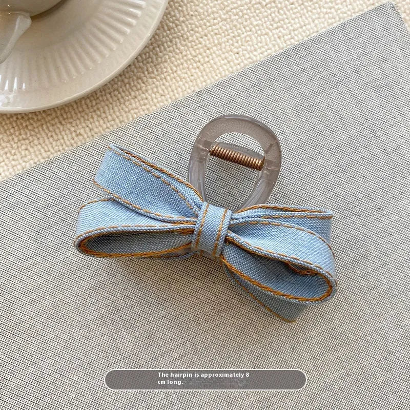 Blue denim bow barrette with cloth bow and metal clip on women back head hair