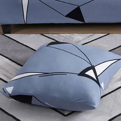 Printed geometric pattern stretch sofa slipcover fitted on a modern three-seater sofa.