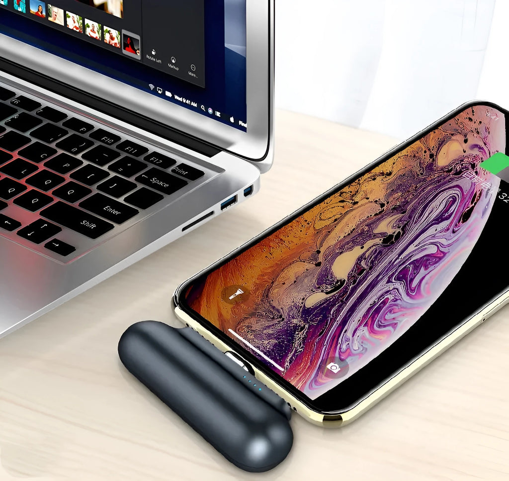 Black 2600mAh mini portable charger with magnetic cable and blue LED indicator on a white background
