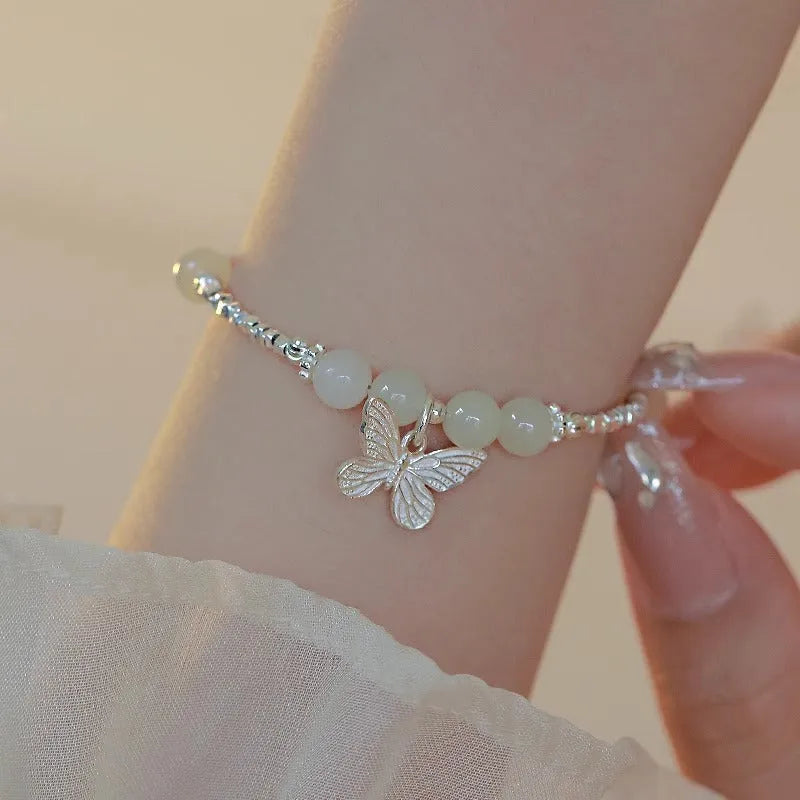 Hetian jade silver butterfly bracelet and necklace set with electroplated copper construction