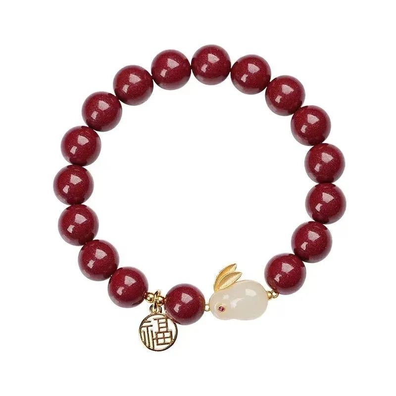 Purple gold sand cinnabar bracelet with jade hare charm, shown with 6mm and 8mm bead size options.
