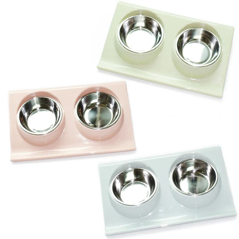 Stainless steel pet double bowl with green PP base and metal inner bowl on floor