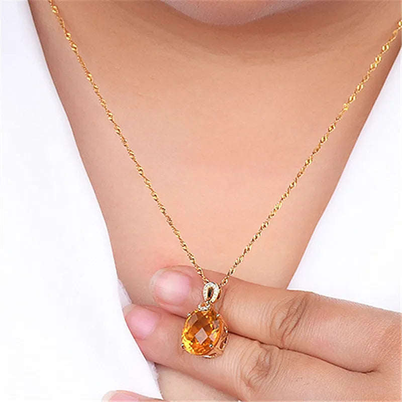 New 8 karat natural citrine pendant in drop shape with copper base and yellow diamond finish