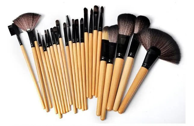 24 professional makeup brushes with wooden handles stored in a black PU gift bag.
