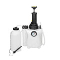 White 3-litre plastic brake fluid tank with copper and iron tools on a workshop bench.