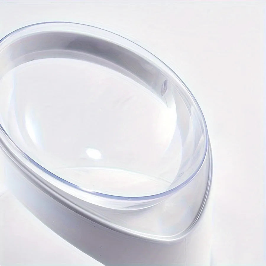 White elevated clear plastic cat food bowl with a tilted feeding surface for neck support.