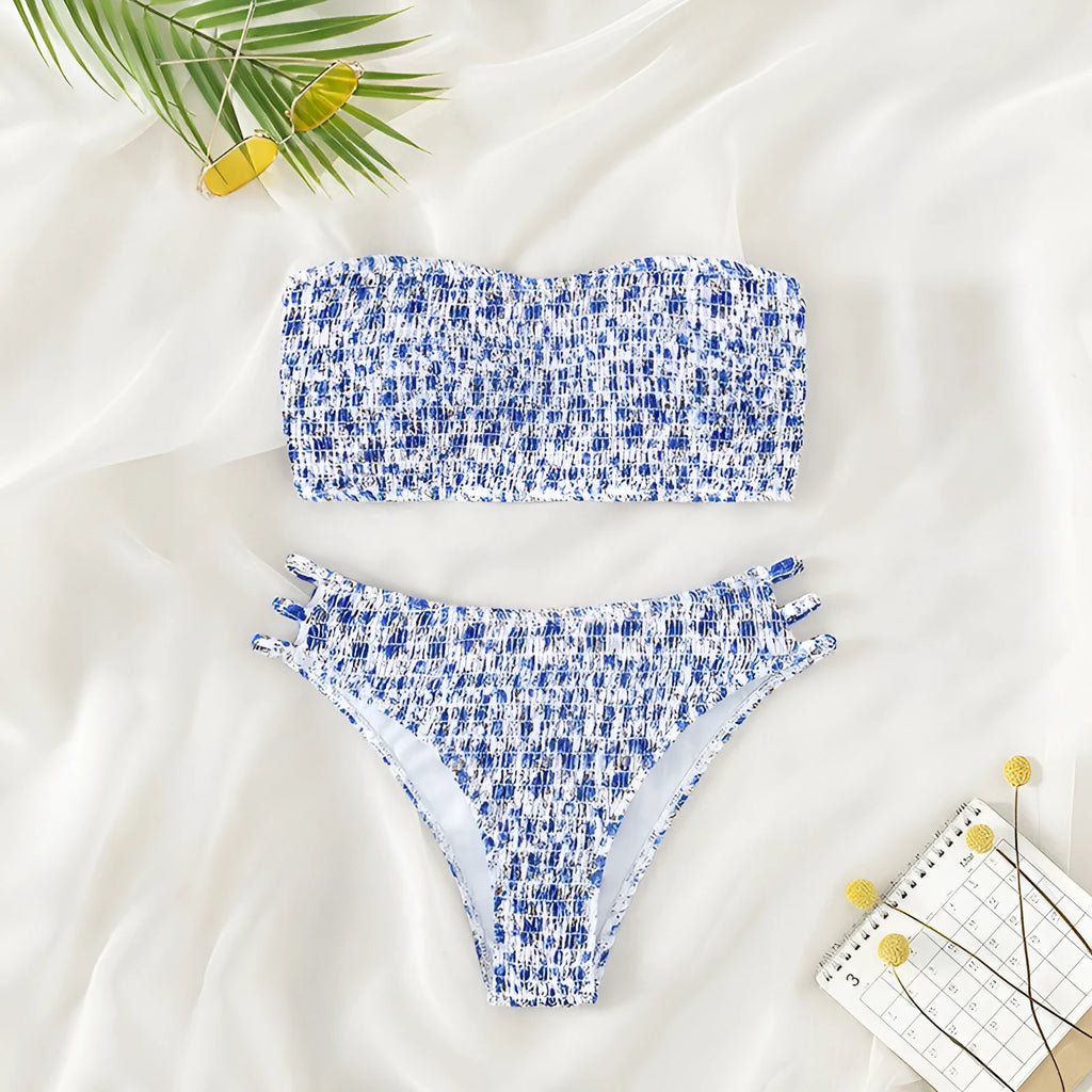 Women's strapless floral swimsuit with high-waist briefs and back split detail.