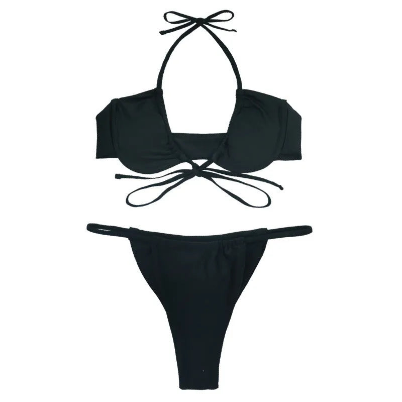 Women's black and mint green two-piece nylon bikini swimsuit set on a white background.