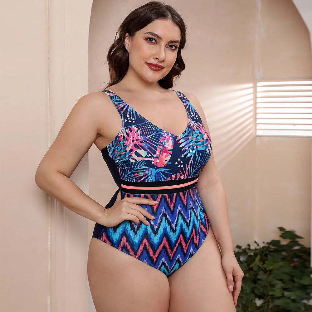 Women's blue striped one-piece swimsuit with spaghetti straps on a mannequin.
