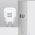White portable universal dual USB phone charger with foldable US, EU, and UK plugs showing 39mm diameter