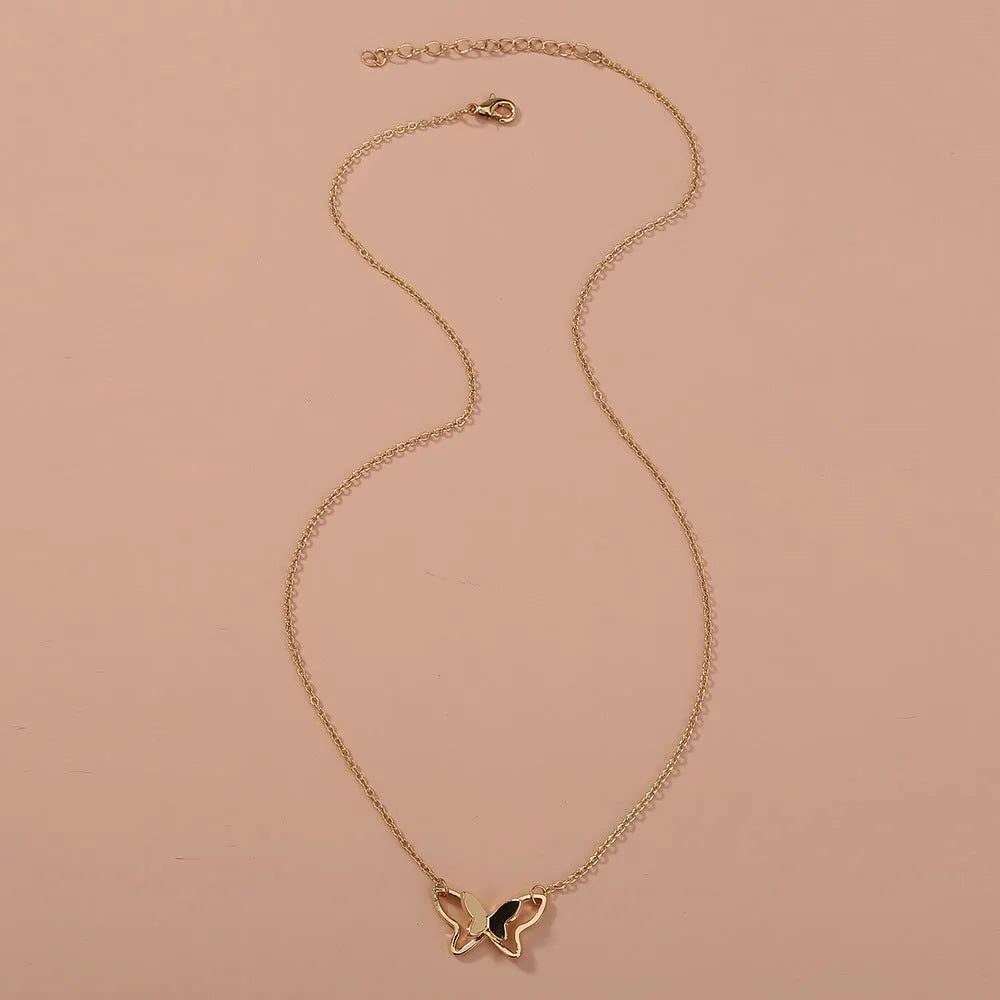 Women's double-layer copper alloy bow pendant necklace on adjustable cross chain